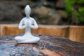 Figure of beautiful young girl meditating and do yoga on wooden surface. With empty space for text Royalty Free Stock Photo