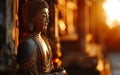 The figure of Buddha illuminated by the soft light of sunrise, symbolizing enlightenme Royalty Free Stock Photo