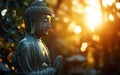 The figure of Buddha illuminated by the soft light of sunrise, symbolizing enlightenme Royalty Free Stock Photo