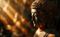 The figure of Buddha illuminated by the soft light of sunrise, symbolizing enlightenme Royalty Free Stock Photo