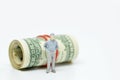 Figure of businessman and one dollar bill Royalty Free Stock Photo