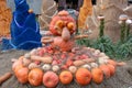 Figure collected from a pumpkin. Fair pumpkins, orange and red vegetables. Pumpkins in the hay.