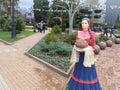 Figure Cossack woman in national dress with loaf in city square, Sochi, Russia