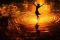 A figure dancing on a lake of glowing ripples Royalty Free Stock Photo