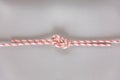 Figure eight Bend or Flemish Bend ship knot on grey background