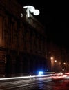 Figure of Fantastic Planet by Amanda Parer looks down at the police patrol on Signal Festival Prague