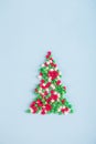 Figure of fir tree consisting of colorful Christmas sprinkles in