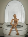 Figure in the form of a human body sitting in the toilet, abdominal pain, diarrhea