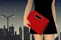 Figure of a girl in a dress with a red bag on background of the night city Royalty Free Stock Photo