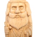 The figure of the good Wizard carved from beech with a staff and a scroll in hands. Decorative toy