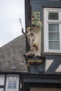 The figure of Hermes on the corner of the facade of a vintage German building