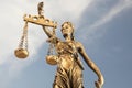 Figure of Lady Justice against sky, low angle view. Symbol of fair treatment under law