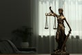 Figure of Lady Justice indoors, space for text. Symbol of fair treatment under law