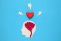 Figure of man with brain and red heart. Love and intelligence Royalty Free Stock Photo