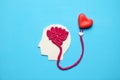 Figure of man with brain and red heart. Love and intelligence Royalty Free Stock Photo