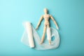 Figure of man with leg wound and white gauze bandage. First aid, injury treatment. Patient in hospital Royalty Free Stock Photo