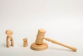 A figure of a man with a void in the form of a child inside the body stands near a child and the hammer of the judge. judicial pro Royalty Free Stock Photo