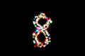 Figure 8 multi-colored bokeh on a black background.On March 8