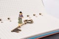 Figure near a key on a notebook Royalty Free Stock Photo