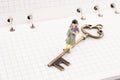 Figure near a key on a notebook Royalty Free Stock Photo