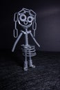 A figure of one small robot assembled from several bolts and nuts standing in a vertical position . It symbolizes technology, Royalty Free Stock Photo