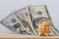 Figure of a pig on the background of dollar bills, piggy bank Royalty Free Stock Photo