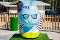 The figure of a rabbit with a foreground in blue and glasses on his face . Beautiful Easter decoration