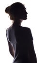 Figure of a sensual young woman standing back and turning around, a beautiful girl with hand-picked hair on a white isolated Royalty Free Stock Photo