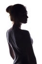 Figure of a sensual young woman standing back and turning around, a beautiful girl with hand-picked hair on a white isolated Royalty Free Stock Photo