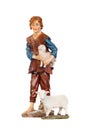 Figure of the shepherd with a sheep for the nativity portal Royalty Free Stock Photo