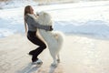 Figure skating woman with dog Samoyed
