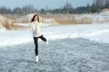 Figure skating woman at the frozen lake