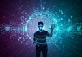 Figure stands in front of a digital, circular interface featuring a Royalty Free Stock Photo
