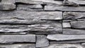 Texture of gray stone wall shape background. the wall is made of various rectangular shapes and sizes of gray stones with cracks Royalty Free Stock Photo