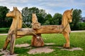 A figure of three horses carved in wood