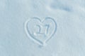 A figure of twenty seven written in the snow in the painted heart.
