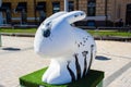 Figure of white rabbit with black beetle or bug on it. Beautiful Easter art decoration .Kyiv Kiev, Ukraine