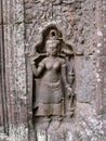 Figure of woman inside a temple in the Khmer temple complex of Angkor