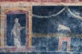 Figure of a woman and lion painted in a Cool on black background in a Domus of Pompeii Royalty Free Stock Photo