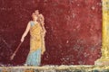 Figure of a woman painted in a Fresco in a Domus of Pompeii, Italy Royalty Free Stock Photo