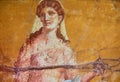 Figure of a woman painted in a Fresco in a Domus of Pompeii Royalty Free Stock Photo