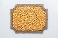 Figured frame made of burlap and corn grains Royalty Free Stock Photo