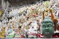 Figures of gods and green head near the temple in Asia