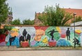 Figures on painted wall in Wallstrasse, Lubeck, July 13, 2022 Royalty Free Stock Photo