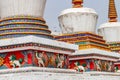 Figures and painting on a Tibetan stupa at the impressive Ta\'er Monastery near Xining, China Royalty Free Stock Photo