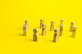 Figures of people stand randomly on a yellow background. People society concept. Behavior and social science relationships