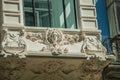 Figures in plaster decoration on balcony of old building in Madrid Royalty Free Stock Photo