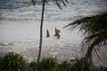 Figures walking on the beach in Michamwi-Pingwe Zanzibar, Royalty Free Stock Photo