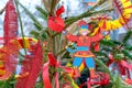 Figurine of a buffoon in an old Russian outfit against the background of Shrovetide decor.