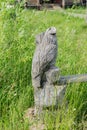 A figurine of carved  wooden eagle  in front of the house Royalty Free Stock Photo